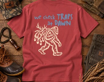 We Check Traps at Dawn Bigfoot Trapping T-Shirt
