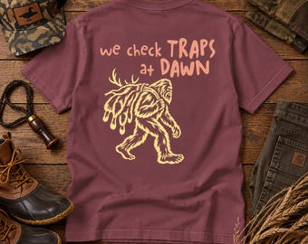 We Check Traps at Dawn Bigfoot Trapping T-Shirt