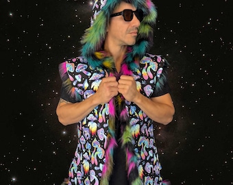 May include: A sleeveless hooded vest featuring a black fabric base with a colorful mushroom print in shades of pink, blue, and yellow. The garment is trimmed with long, multi-colored faux fur in vibrant hues of pink, green, and blue along the edges.
