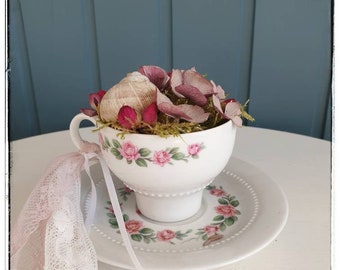 Floral decoration in coffee cup, vintage look