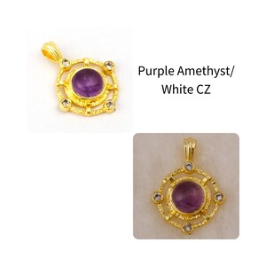 May include: A gold-colored pendant with a round, purple amethyst center stone and four white CZ stones. The pendant has a decorative, openwork design and a loop for a chain. The text "Purple Amethyst/ White CZ" is visible.