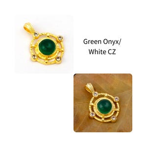 May include: Gold-toned pendant with a circular green onyx stone at the center, surrounded by a decorative frame and four white CZ stones. The pendant has a loop for a chain. Text reads "Green Onyx/ White CZ".