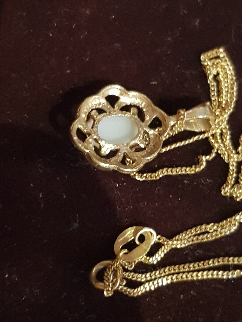 yellow gold Ethiopian opal necklace and stud earrings
