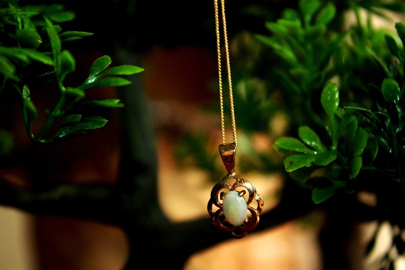 yellow gold Ethiopian opal necklace and stud earrings