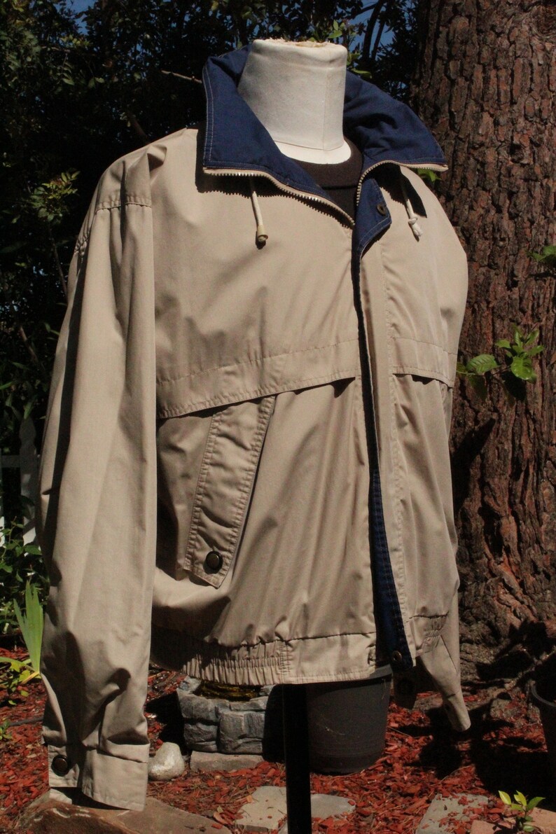 windbreaker with hidden hood