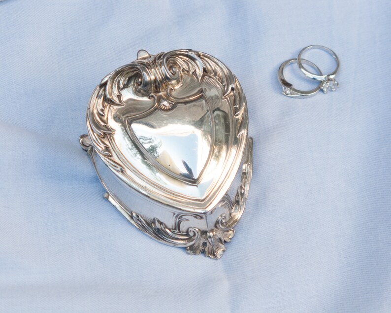 Antique silver plated jewelry box with blue velvet lining
