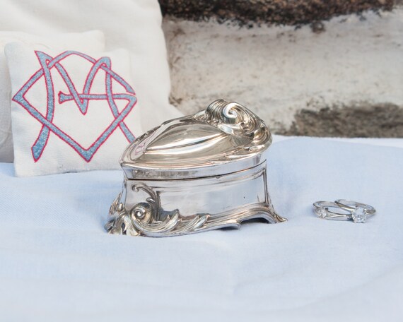 Antique silver plated jewelry box with blue velvet