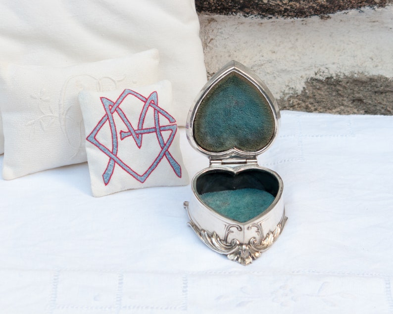 Antique silver plated jewelry box with blue velvet lining