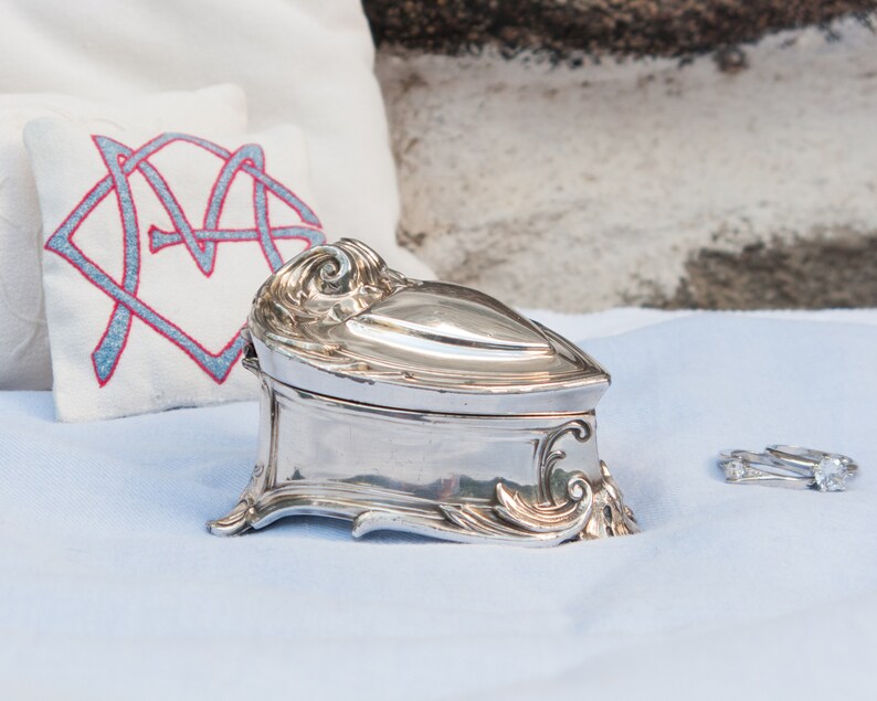 Antique silver plated jewelry box with blue velvet lining