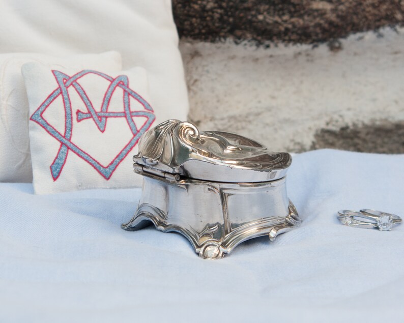 Antique silver plated jewelry box with blue velvet lining
