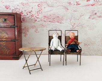 Antique tin toys set of a table and two chairs