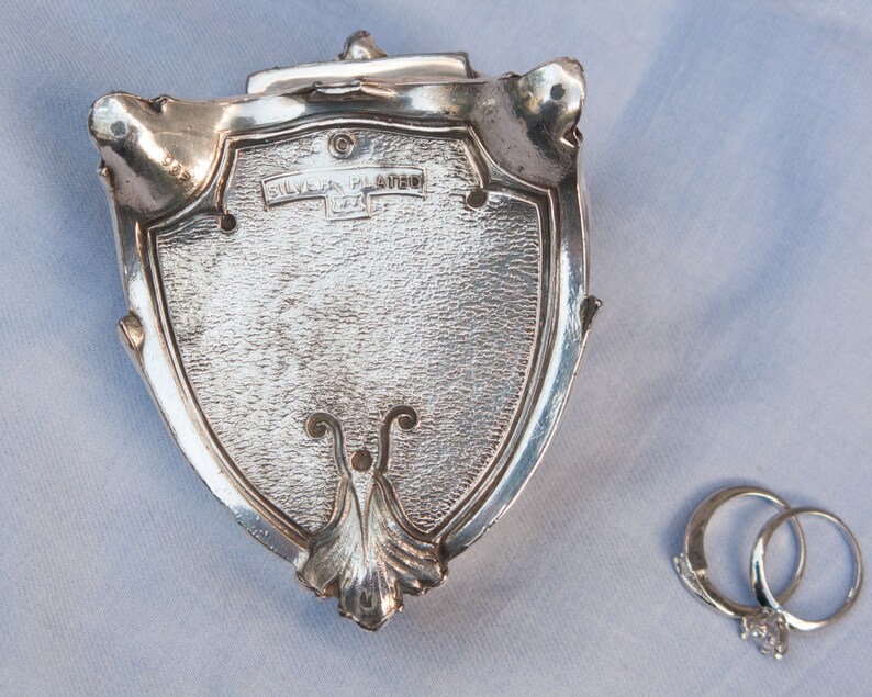 Antique silver plated jewelry box with blue velvet lining