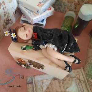 sleeping MARY POPPINS handmade in polymer clay without molds on a wooden box