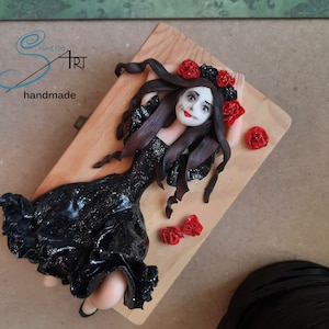 CATRINA handmade in polymer clay without molds on a wooden box