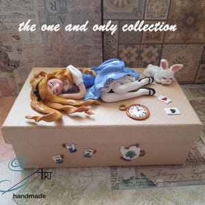 ALICE asleep in Wonderland, handmade on a cardboard box