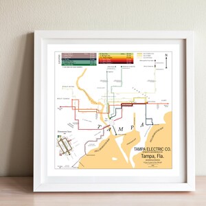 May include: A vintage map of Tampa, Florida, showing the routes of the Tampa Electric Company's streetcar system. The map is in a yellow, orange, and green color scheme and features the text "Tampa Electric Co. Streetcar Service in Tampa, Fla. Cigar Capital of the World."