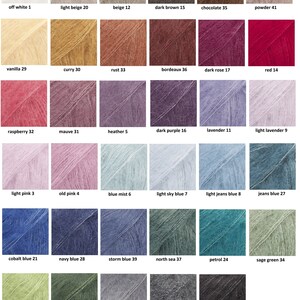 May include: A color chart displaying a variety of yarn colors. The chart includes shades like off-white, beige, brown, red, pink, purple, blue, green, and grey. Each color is labeled with a name and a number.