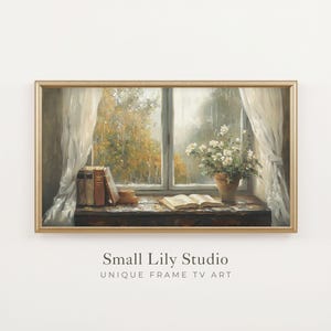 Peut inclure: Une impression d'art numérique encadrée montrant une vue par la fenêtre sur un paysage automnal pluvieux avec des rideaux blancs, des livres, un livre ouvert et une plante en pot à fleurs blanches. Le texte indique Small Lily Studio.