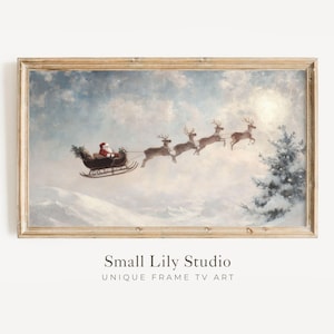 May include: A framed vintage-style painting depicts Santa Claus in a sleigh pulled by reindeer, flying through a snowy sky. The artwork features a soft color palette with a winter landscape and a Christmas theme.