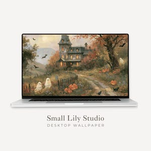 May include: A silver laptop displaying a digital wallpaper of a haunted mansion scene with ghosts, pumpkins, and bats in an autumn landscape. The text Small Lily Studio Desktop Wallpaper is printed in dark grey below the laptop screen.