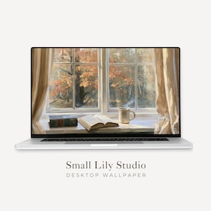 May include: A silver laptop displaying a digital wallpaper of an open book and a ceramic mug on a windowsill, with light beige curtains framing a view of autumn trees outside. The text Small Lily Studio DESKTOP WALLPAPER appears below the laptop.
