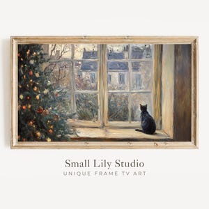 May include: A framed painting shows a black cat looking out of a window at a snowy scene. A Christmas tree with decorations is on the left. The painting is labelled "Small Lily Studio UNIQUE FRAME TV ART."