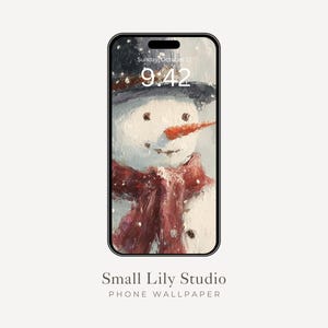 Op de afbeelding: Een smartphone toont een winterthema telefoonachtergrond. Het kunstwerk toont een sneeuwpop met een zwarte hoed, een oranje wortelneus en een rode sjaal. De tijd is 9:42 uur op zondag 17 oktober. De tekst onderaan luidt "Small Lily Studio PHONE WALLPAPER."