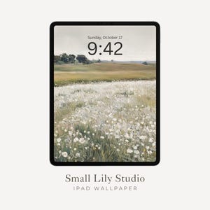 May include: An iPad displaying a digital wallpaper with a serene landscape painting. The artwork features a field of white flowers, green grass, and a distant treeline under a soft, overcast sky. The time is 9:42 AM, Sunday, October 17. The text "Small Lily Studio IPAD WALLPAPER" is at the bottom.
