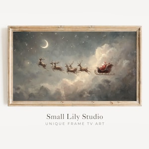 Peut inclure: Une impression encadrée du Père Noël dans un traîneau tiré par des rennes volant dans un ciel nuageux nocturne avec un croissant de lune. L'impression a une esthétique vintage et le texte "Small Lily Studio UNIQUE FRAME TV ART".