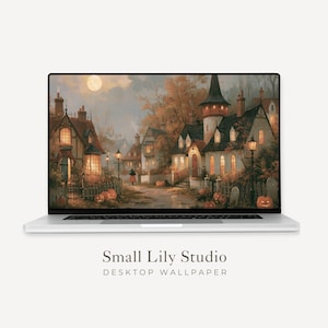 Könnte beinhalten: Ein silberner Laptop mit einer digitalen Illustration eines Dorfes in der Abenddämmerung, warm leuchtenden Fenstern, herbstlichen Bäumen und geschnitzten Kürbissen. Der Text Small Lily Studio DESKTOP WALLPAPER steht unter dem Bildschirm.