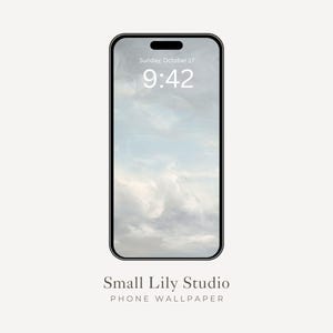 May include: A smartphone with a black frame displays a cloudy sky wallpaper. The time 9:42 is visible on the screen, along with the date. The words "Small Lily Studio" and "PHONE WALLPAPER" are printed below the phone.