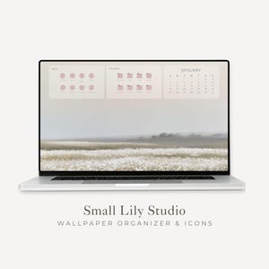 May include: A silver laptop displaying a digital desktop wallpaper organiser with a landscape background of a field. The screen features three translucent sections labelled APPS, FOLDERS, and JANUARY, with a calendar grid and circular icons.