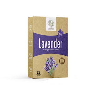 May include: A box of lavender-scented foaming hand soap tablets. The box is made of brown cardboard and features a purple and white design with a lavender flower illustration. The text on the box reads "Lavender Foaming Hand Soap Tablets" and "12 Foaming Soap Tablets".