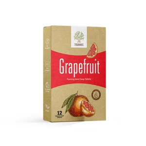 May include: A box of 12 grapefruit scented foaming hand soap tablets. The box is brown with a red stripe and a drawing of a grapefruit. The text on the box reads "TERRAAMANDA Grapefruit Foaming Hand Soap Tablets".