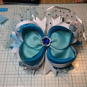 A fun intricately folded & hand sewn Blue on Blue bow, Free Shipping.