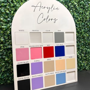 May include: A white acrylic sample chart with the title "Acrylic Colors". The chart shows 14 different colors of acrylic, including white, frosted, clear, gray, pink, translucent pink, red, navy blue, gloss black, purple, beige, tan, ivory, matte black, matte purple, matte beige, and matte baby blue.