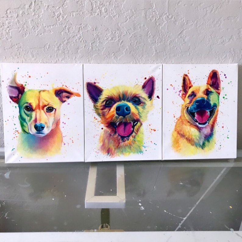 May include: Three colorful paintings of dogs on canvas. Each painting features a different dog breed with a vibrant rainbow color scheme and white splatters of paint.