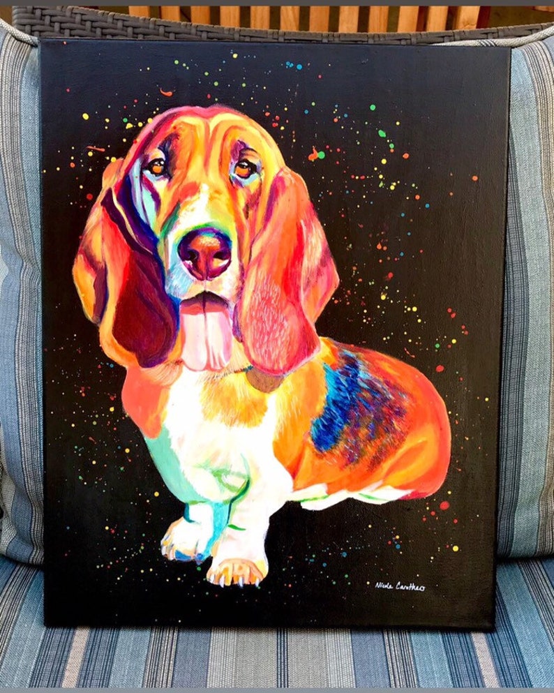May include: A colorful painting of a basset hound dog with a black background and colorful splatter paint. The dog is painted in shades of orange, red, yellow, blue, and white. The artist's signature is in the bottom right corner.