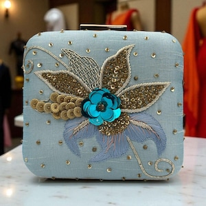 Sabyasachi-Inspired Blue Clutch with Hand-Embroidered Floral Design