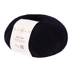 May include: A skein of Rowan Fine Lace yarn in a deep purple color. The label reads "Rowan Fine Lace made with baby Suri alpaca & fine merino wool 50g".