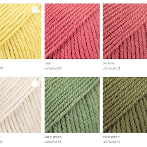 May include: Six skeins of yarn in different colors: lemon yellow, rose, old rose, light beige, laurel green, and moss green. Each skein is labeled with the color name and a corresponding uni color number.