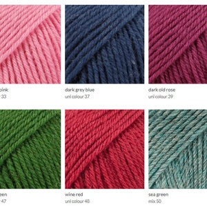 May include: Yarn samples in ten colors: medium pink, dark grey blue, dark old rose, forest green, wine red, sea green, light blue, light pink, dark green, and dark blue. Each sample is labeled with the color name and uni color number.