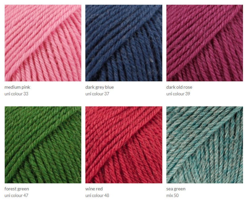 May include: Yarn samples in ten colors: medium pink, dark grey blue, dark old rose, forest green, wine red, sea green, light blue, light pink, dark green, and dark blue. Each sample is labeled with the color name and uni color number.