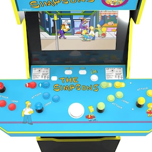 Könnte beinhalten: Ein blauer und gelber Arcade-Automat mit einem Bildschirm, der ein Videospiel mit Figuren aus den Simpsons zeigt. Der Automat hat ein Bedienfeld mit Knöpfen, die mit "Angriff", "Sprung" und "Leben" beschriftet sind.
