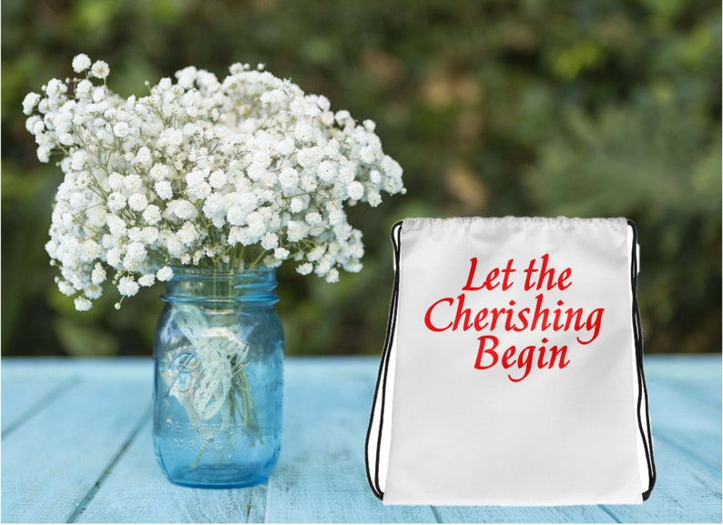 Let the Cherishing Begin Drawstring Bag carry-all celebrate caring and upbeat energy wear on back 15 x 17 inch thin straps unisex