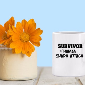 Survivor of Human Shark Attack Mug Joke commemorative mug, surviving major betrayal, humorous gift for hanging on, perseverence award image 2