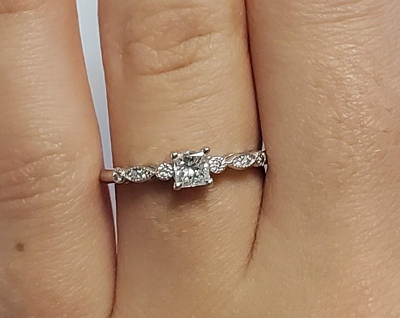 Vintage Princess cut diamond engagement ring.