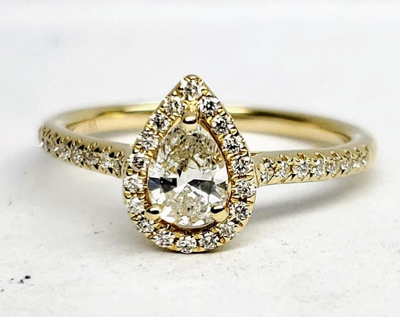 14kt yellow gold pear shape diamond engagement ring.