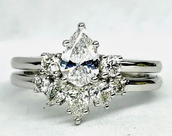 Pear shape diamond engagement and wedding set in 14kt white gold. Bridal set