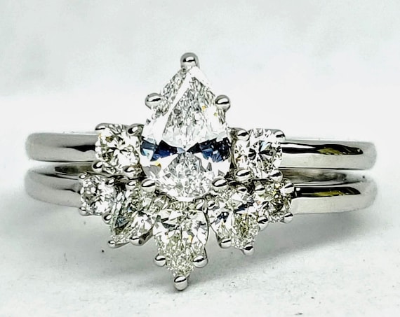 Pear shape diamond engagement and wedding set in 14kt white gold. Bridal set